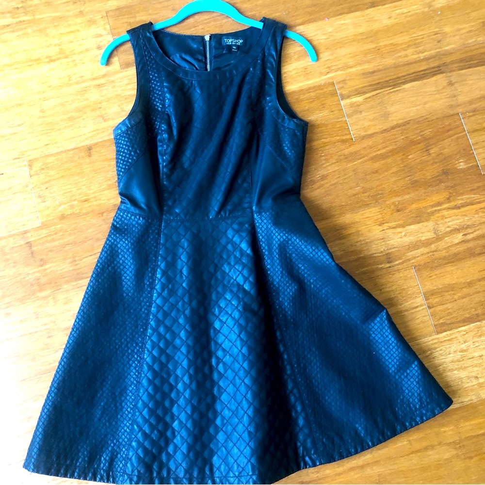 Mini black quilted leather-like dress